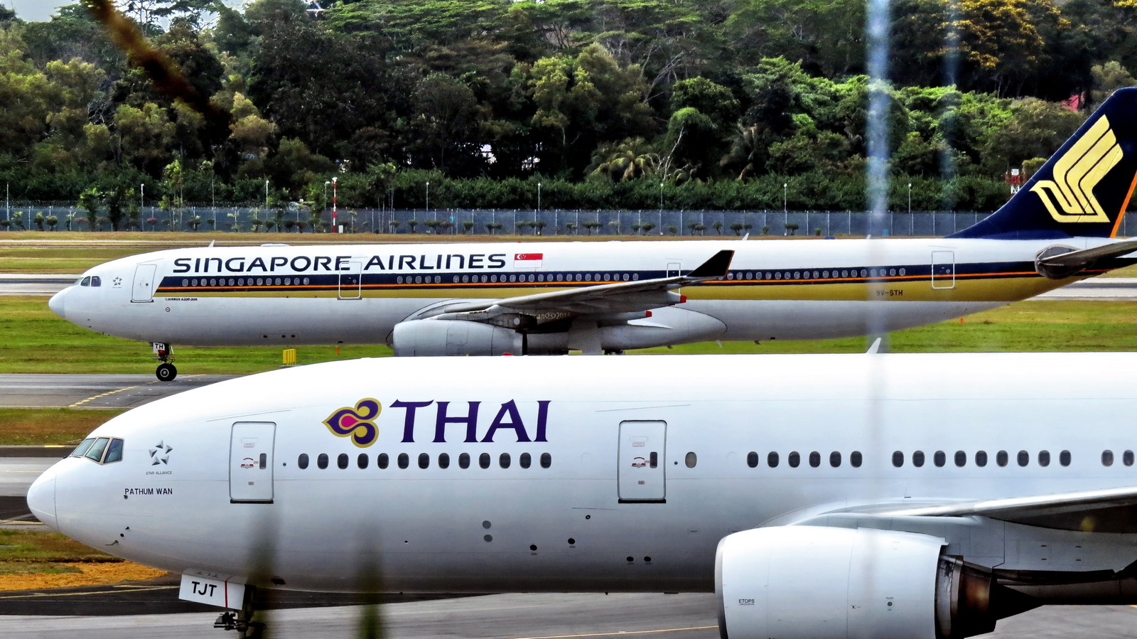 Singapore and Thai airliners on the ground